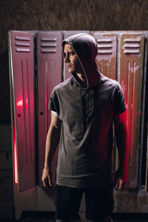 Man get ready for boxing training in the locker roomの写真素材