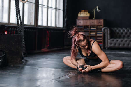 Young girl doing sports in the gym. Atmospheric gymの写真素材
