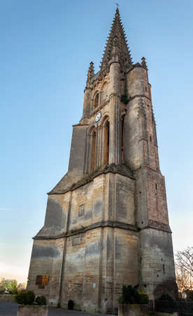 St. Emilion in Aquitaine, France. View of the bell tower of the monolithic church, carved out of the limestone rock from the 12th century, symbol of the medieval village famous for its fine wines.の写真素材