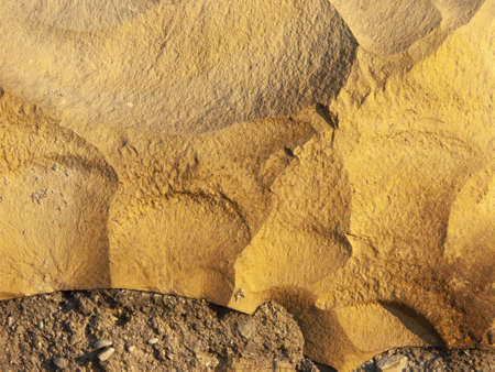 Typical detail of an ancient Italian house wall, made of hand-carved river stones. Wall with which rural houses were built in the 20th century in the Po valleyの写真素材