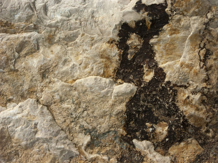 Typical detail of an ancient Italian house wall, made of hand-carved river stones.