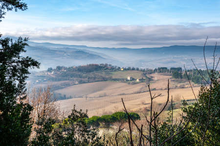 Todi in Umbria, Italy. Panorama from the hill on which the medieval city rises, from the valley of the middle course of the Tiber river, which flows towards Orvieto and Rome.の写真素材