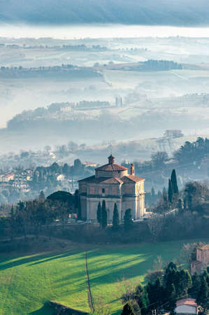 Todi in Umbria, Italy. Panorama from the medieval city of the Church of the "SS. Crocifisso" and of the valley of the Tiber river, which flows towards Orvieto and Rome.の写真素材