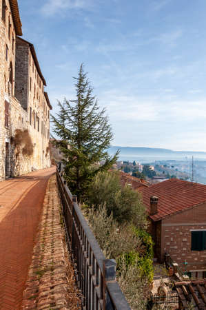 Todi in Umbria, Italy. View of the ancient village full of medieval buildings. It rises on the hills since the Etruscan times and overlooks the valley of the Tiber river.の写真素材