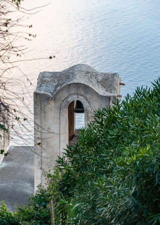 Ravello, a splendid village and tourist resort on the famous Amalfi Coast. View of the pedestrian street that descends to the sea and to Amalfi, with detail of the church of "Santa Maria delle Grazie".の写真素材