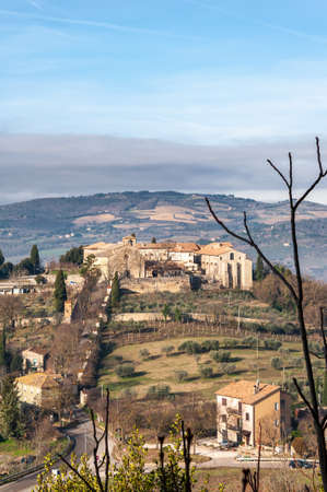 Todi in Umbria, Italy. Panorama from the hill on which the medieval city rises, from the valley of the middle course of the Tiber river, which flows towards Orvieto and Rome.の写真素材