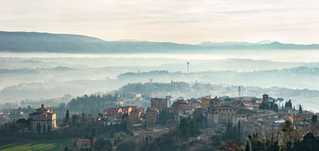 Todi in Umbria, Italy. Panorama from the medieval city of the Church of the "SS. Crocifisso" and of the valley of the Tiber river, which flows towards Orvieto and Rome.の写真素材
