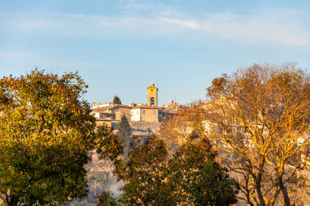 Spoleto in Umbria, Italy. View of the bell tower of the church of Sant'Eufemia and of the medieval city from the hills that surround it.の写真素材
