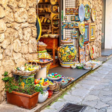Ravello, a village and tourist resort on the Amalfi Coast, with the Gulf of Naples behind and close to Amalfi, Sorrento and Pompeii. Showcase with display of artistic ceramics.の写真素材