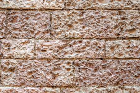 Assisi, the city of peace, Italy. Medieval wall detail in typical pink stone.