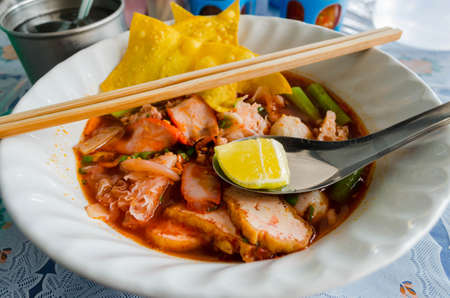 rice noodles in pink soupの写真素材