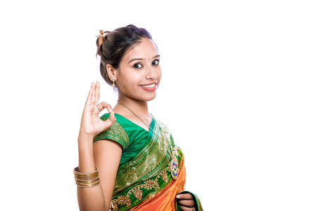 Happy young beautiful traditional Indian woman in traditional sareeの写真素材