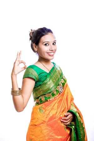 Happy young beautiful traditional Indian woman in traditional sareeの写真素材