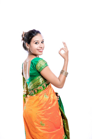 Happy young beautiful traditional Indian woman in traditional sareeの写真素材