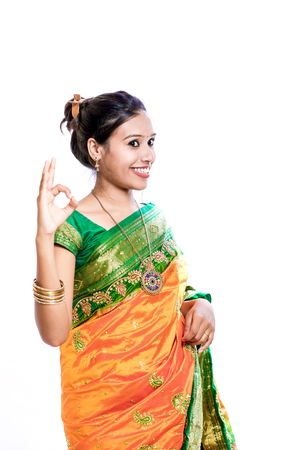 Happy young beautiful traditional Indian woman in traditional sareeの写真素材