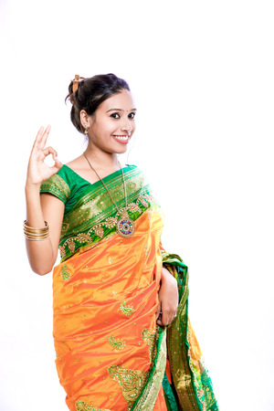 Happy young beautiful traditional Indian woman in traditional sareeの写真素材