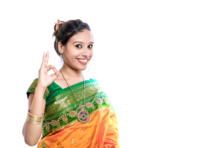 Happy young beautiful traditional Indian woman in traditional sareeの写真素材