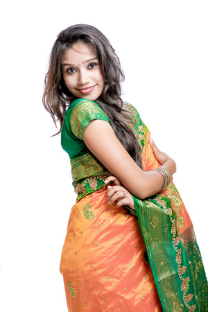 Happy young beautiful traditional Indian woman in traditional sareeの写真素材