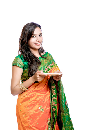 Happy young beautiful traditional Indian woman in traditional sareeの写真素材