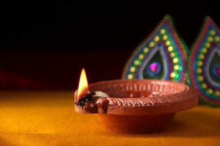 Rangoli design around Diwali lamp