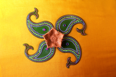 Rangoli design around Diwali lampの写真素材