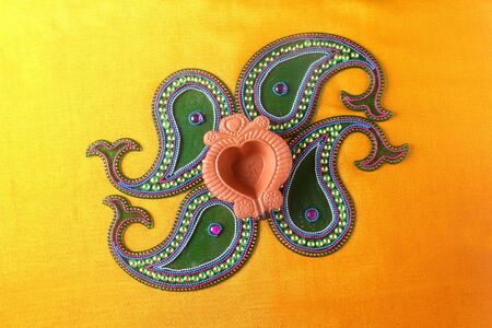 Rangoli design around Diwali lampの写真素材