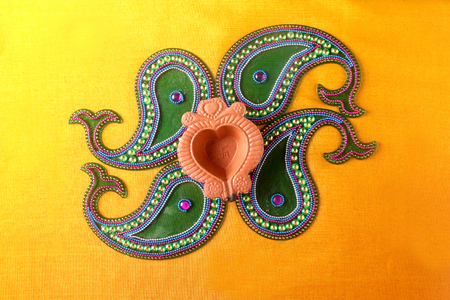 Rangoli design around Diwali lampの写真素材