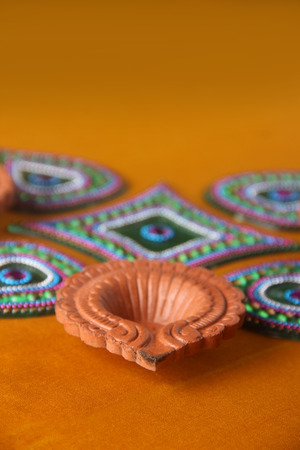 Rangoli design around Diwali lampの写真素材