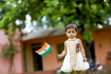 indian girl child holding indian flagの写真素材