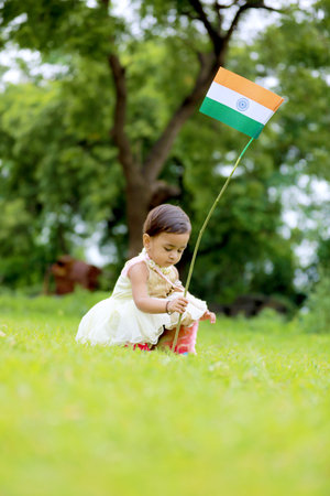 indian girl child holding indian flag