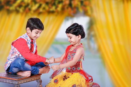 cute Indian child brother and sister celebrating raksha bandhan festivalの写真素材
