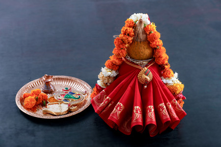 decorative kalash with coconut and leaf with floral decorationの写真素材