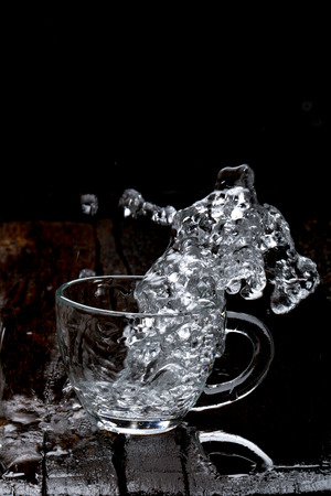 water splash in glass cupの写真素材