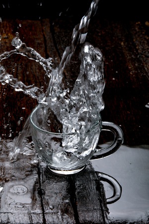 water splash in glass cupの写真素材
