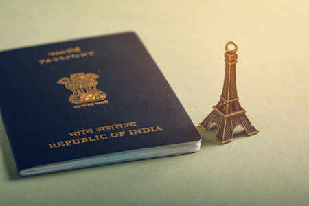 travel concept , Indian passport with Eiffel tower miniatureの写真素材