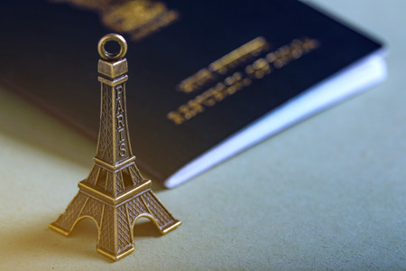 travel concept , Indian passport with Eiffel tower miniatureの写真素材