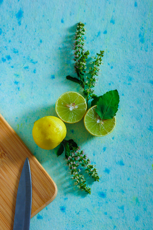 fresh yellow and green lemon on blue backgroundの写真素材