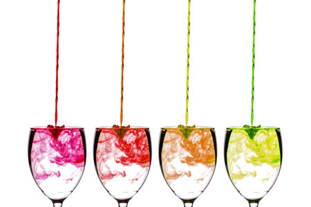 coloring diffuse in water inside wine glassの写真素材