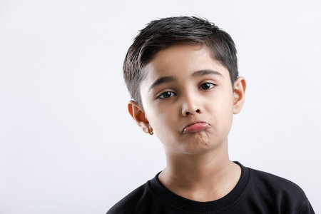 Cute Indian little boy giving multiple expressionの写真素材