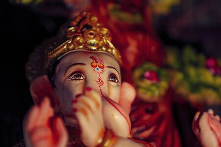 Lord Ganesha, Ganesha Festival, Lord Ganesha Statue on dark backgroundの写真素材