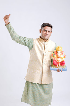 Young Indian man with Lord Ganesha , Celebrating Ganesh festivalの写真素材