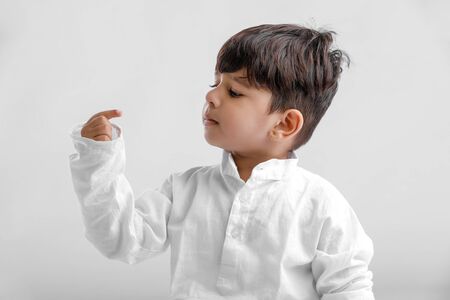 Indian little boy in Traditional Wear and Showing multi pal expressionの写真素材