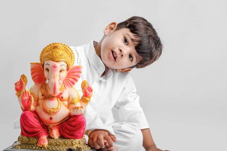 Little Indian boy with lord ganesha , Celebrating Ganesh Festivalの写真素材