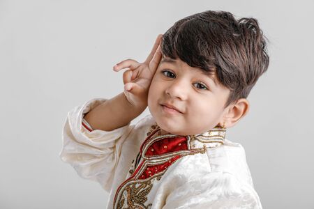 Cute Child in ethnic wear and giving multiple expressionの写真素材