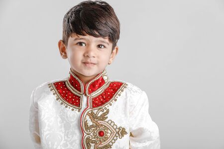 Cute Child in ethnic wear and giving multiple expressionの写真素材