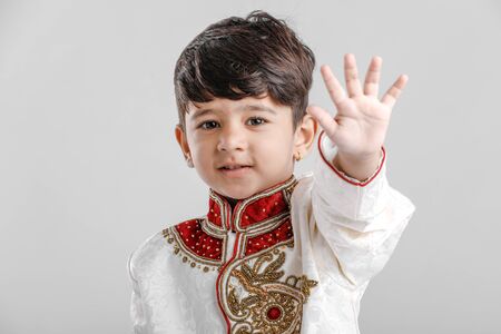 Cute Indian /Asian Child showing five fingerの写真素材