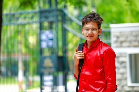 Indian college boy with Holding bagの写真素材