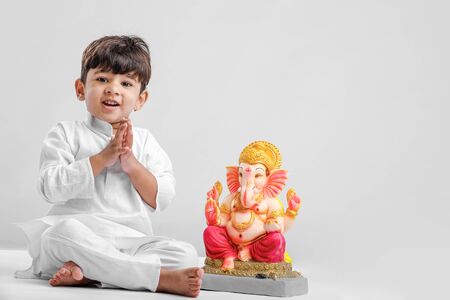 Little Indian boy with lord ganesha , Celebrating Ganesh Festivalの写真素材
