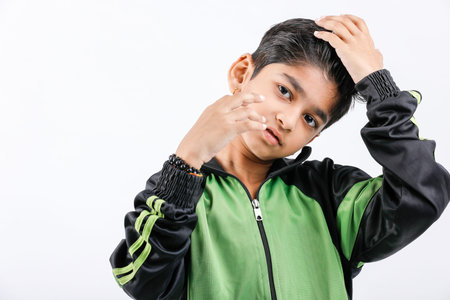 Cute Indian little boy playing and giving multiple expression