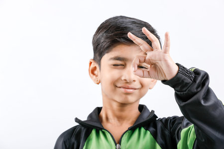 Cute Indian little boy playing and giving multiple expression